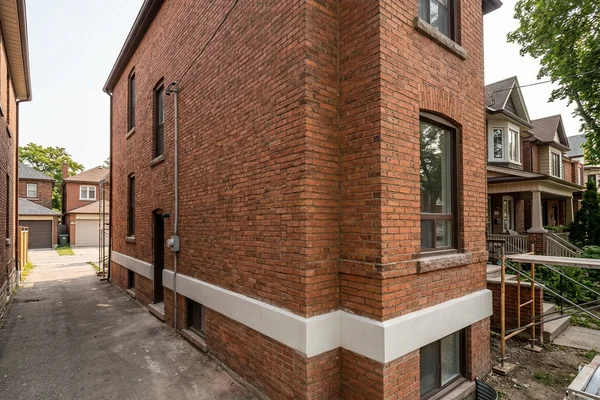 After: Repointed facade and renewed parging band