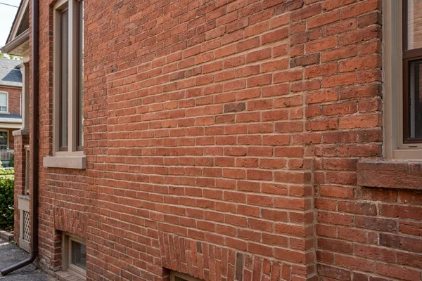 After: Reclaimed brick set in matched lime mortar