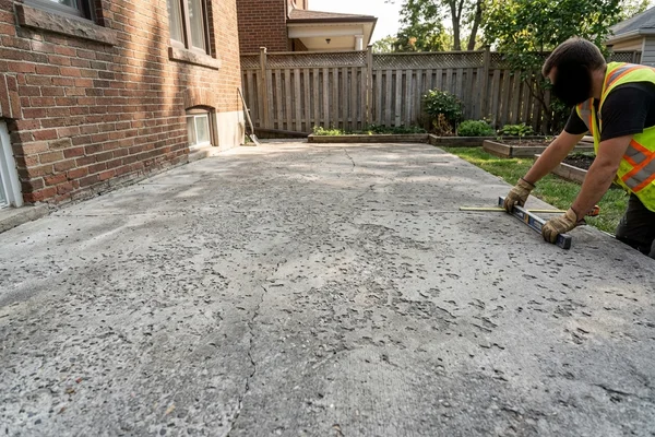 Before: Worn, scaled grey patio
