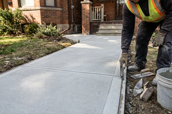 Repaired concrete walkway with new control joints