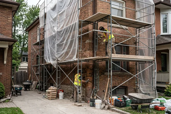 Edwardian heritage facade under restoration with scaffolding and dust sheeting