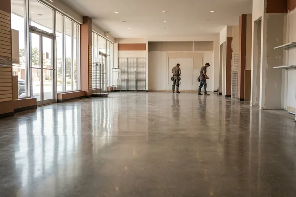 High-gloss polished concrete in a retail plaza unit